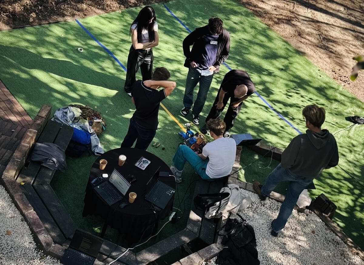 Participants with their hardware on the lawn, seen from above